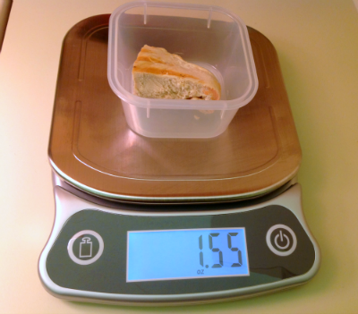 measure chicken breast on kitchen scale for diet