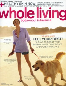 Cover of Whole Living Magazine with woman and dog walking on beach